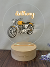 a wooden stand with a picture of a motorcycle on it