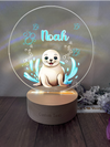 a personalized lamp of a seal on a wooden base