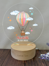 a personalized glass ornament with a hot air balloon