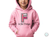 a young boy wearing a pink hoodie with the f is for frega