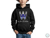 a young boy wearing a black hoodie with the letter w on it