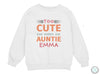 a white sweatshirt with the words too cute for words ask anie emma