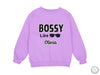 a purple sweatshirt that says bossy like olvia