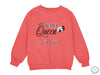 a pink sweatshirt with a black and white queen on it